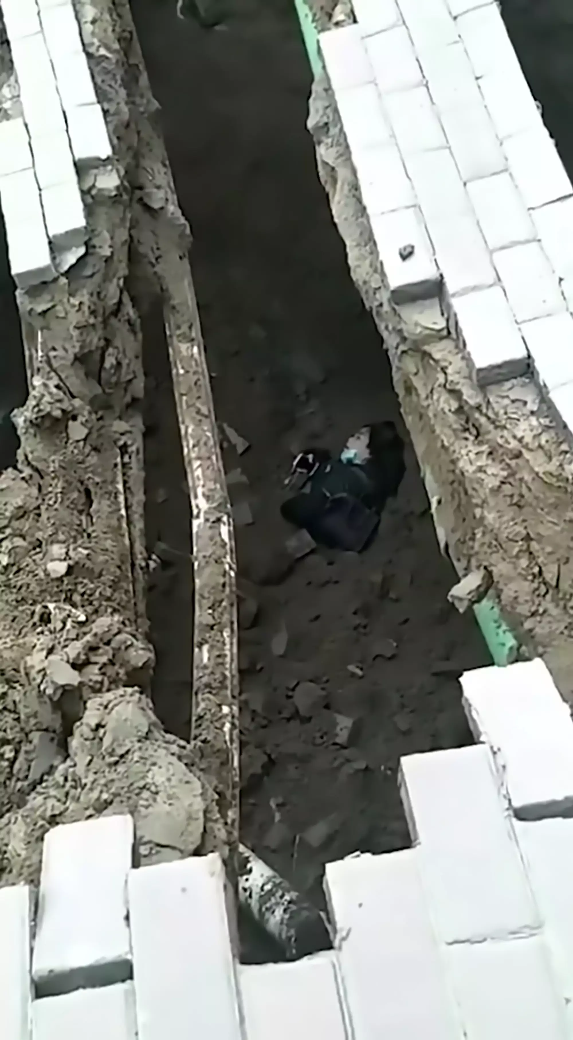 The woman broke two ribs as she fell through the sinkhole.