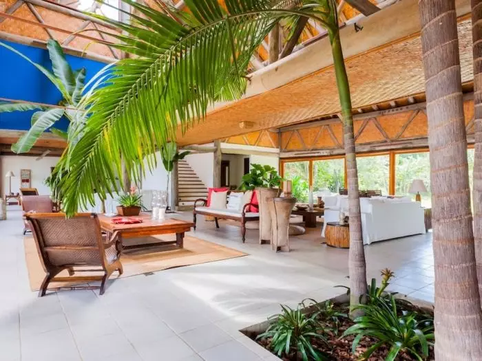 It features skylights, as well as palm and banana trees, eucalyptus posts and beams (