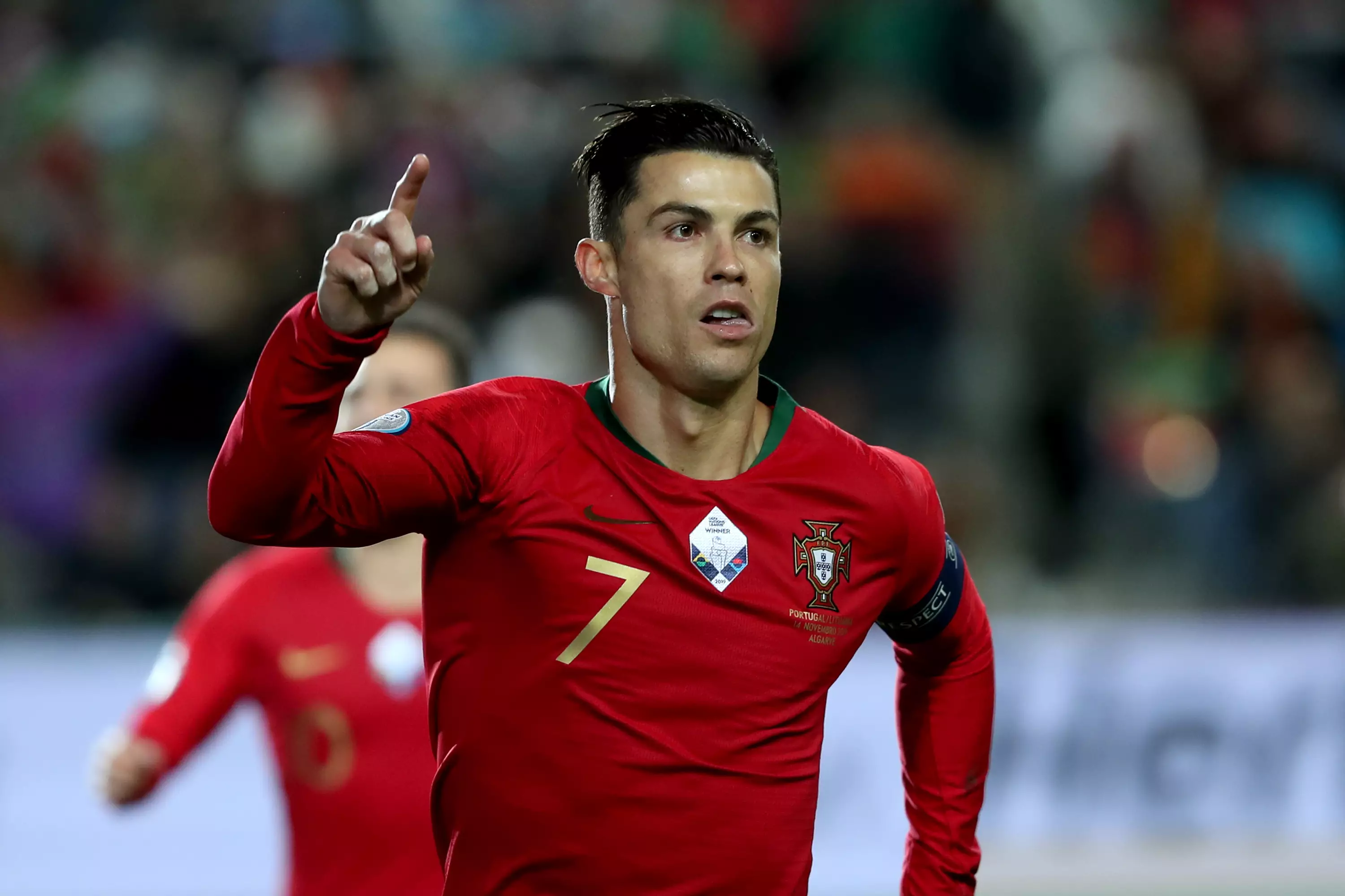 Ronaldo celebrates scoring against Lithuania