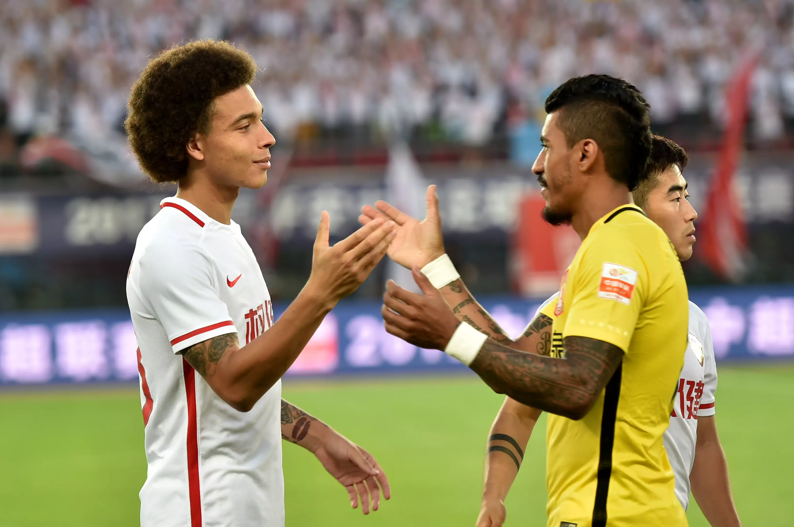 Witsel and Paulinho meet in the Chinese Super League. Image: PA Images.