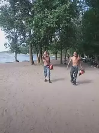 The two men stormed a gathering on a beach in Toronto.