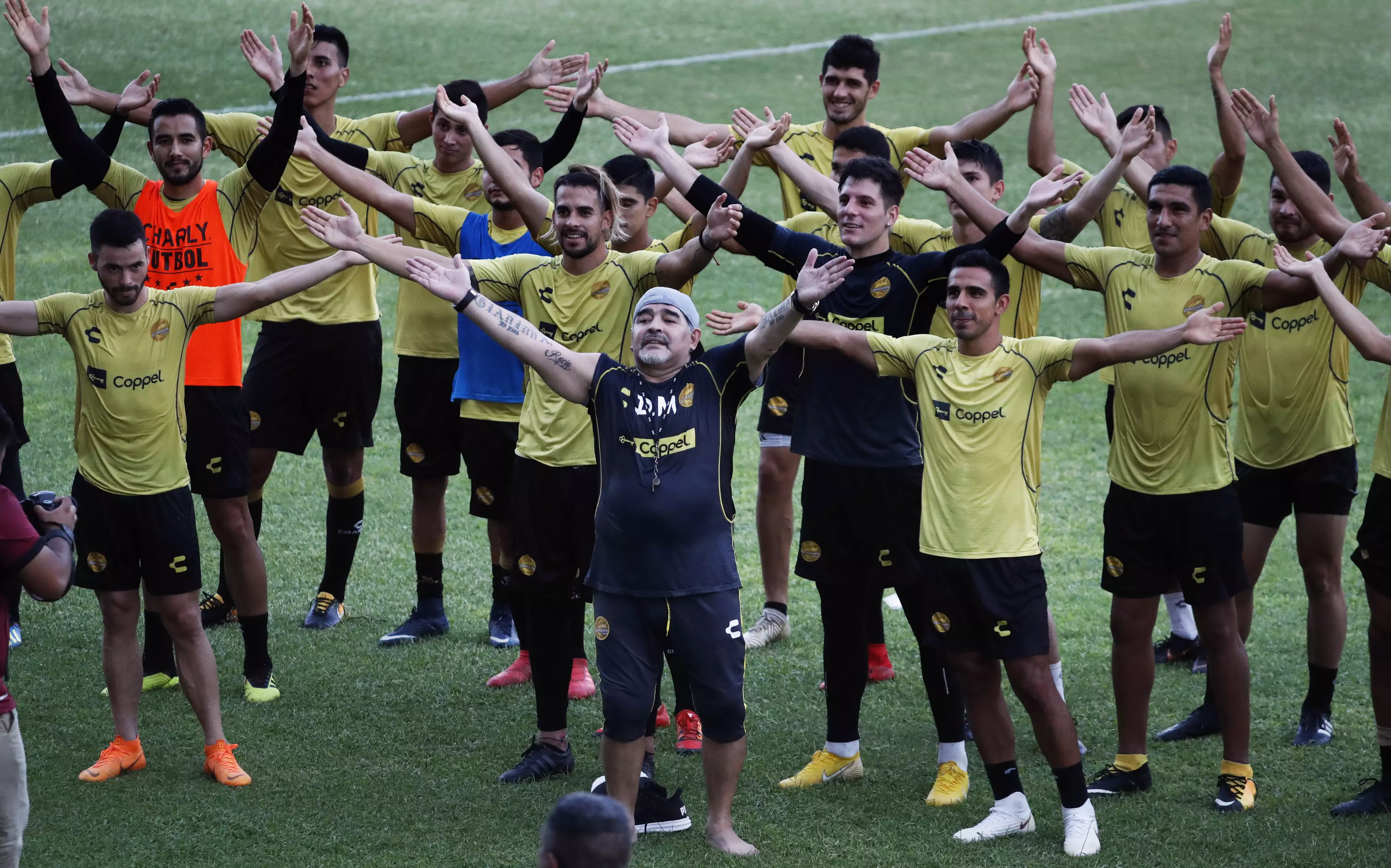 Diego Maradona, or the hotel rep who's too old for the job taking the residents for aerobics. Image: PA Images