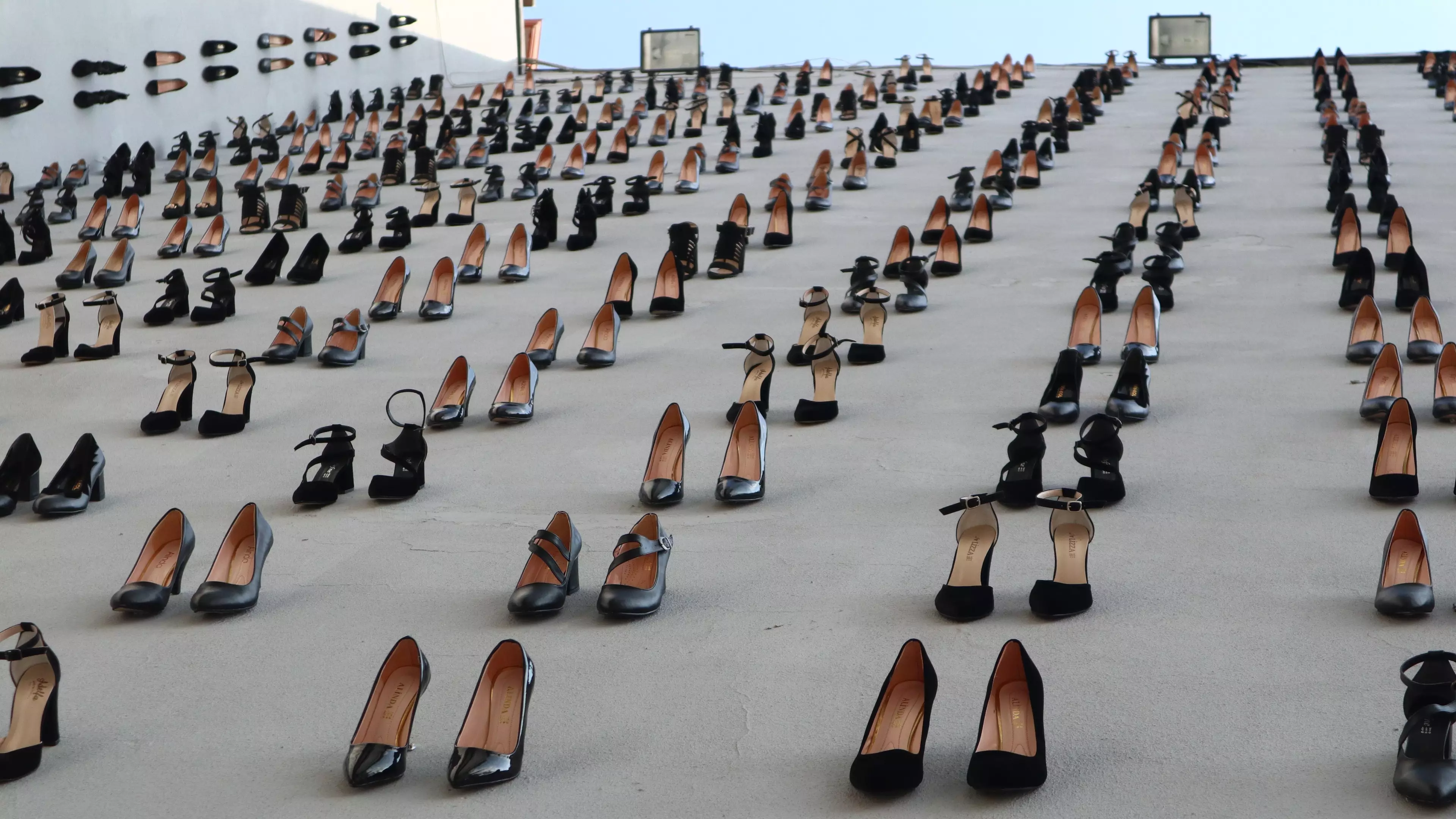 Artist Hangs 440 Shoes Off Building To Show How Many Women Were Killed By Their Husbands