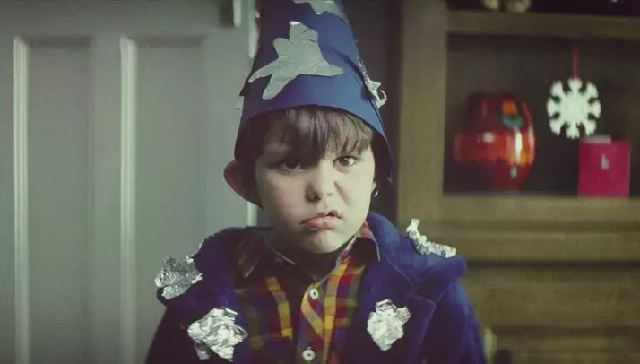 The ad tells the story of a young by waiting for Christmas (