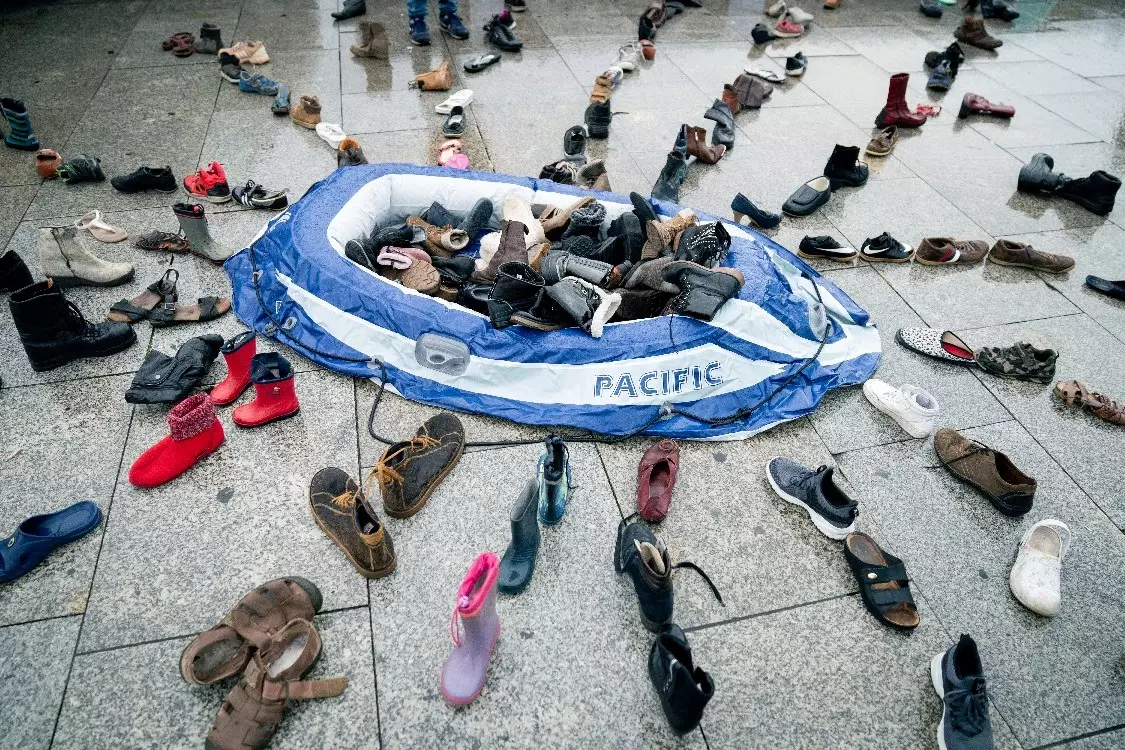 A rubber dinghy and around 200 pairs of shoes marking the 5th anniversary of the death of child migrant Alan Kurdi.