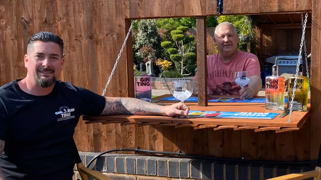Neighbours Build Gin Hatch In Garden Fence To Drink Together During Lockdown