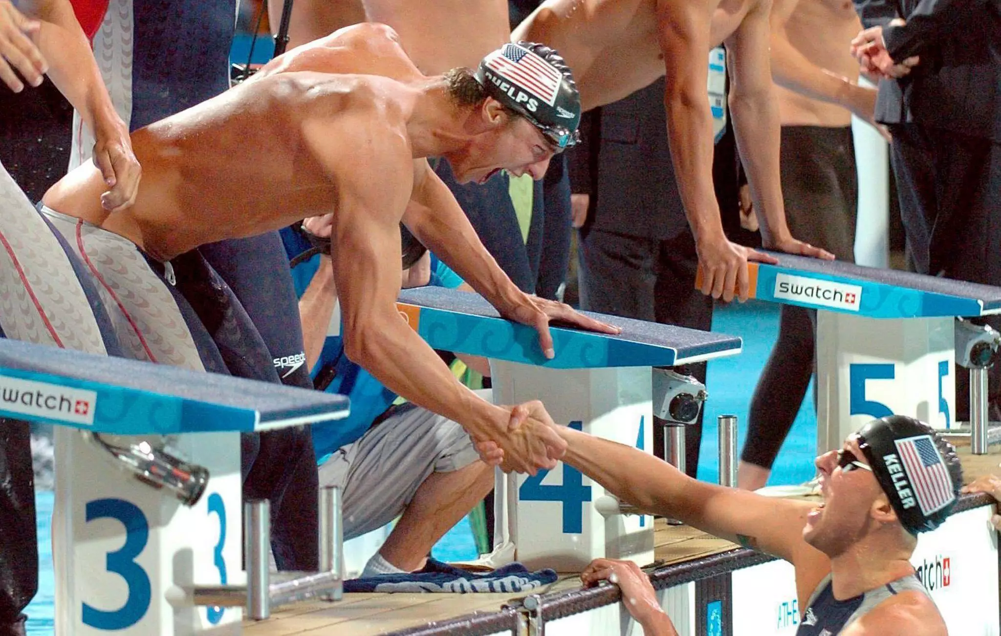 Keller being congratulated by team mate Michael Phelps in the 2004 Olympics.