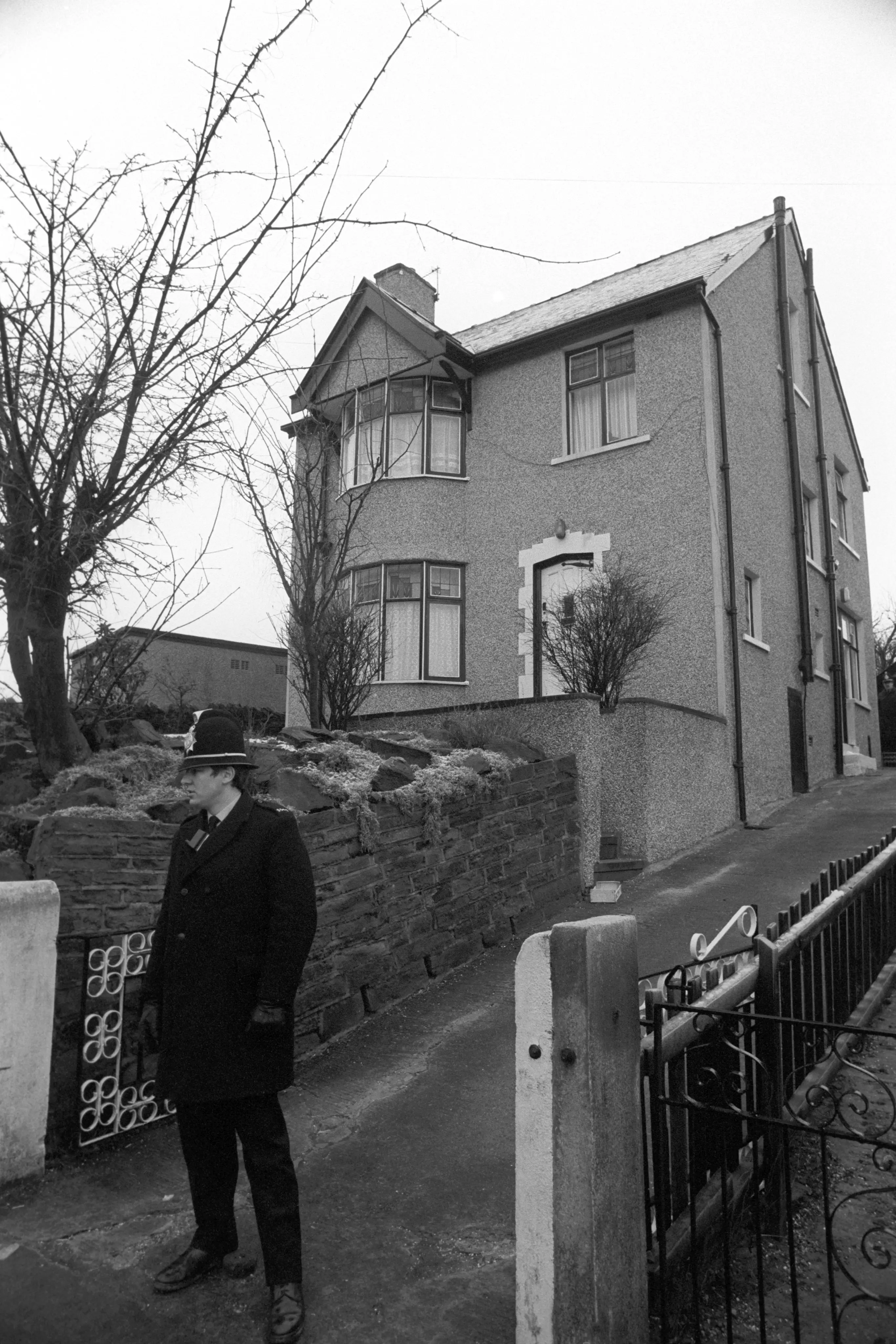 A policeman outside Sutcliffe's home.