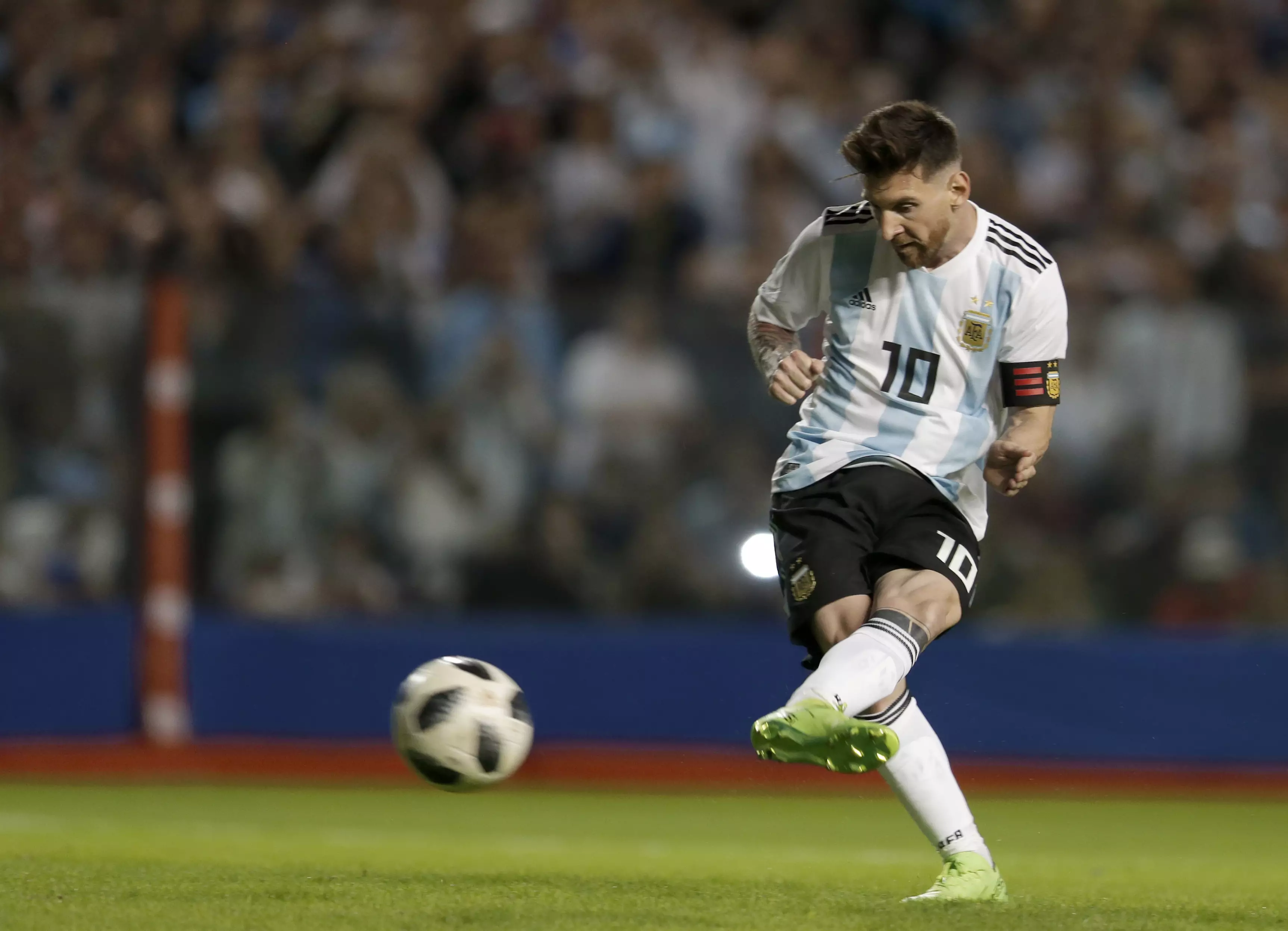 Messi tucks away a penalty. Image: PA