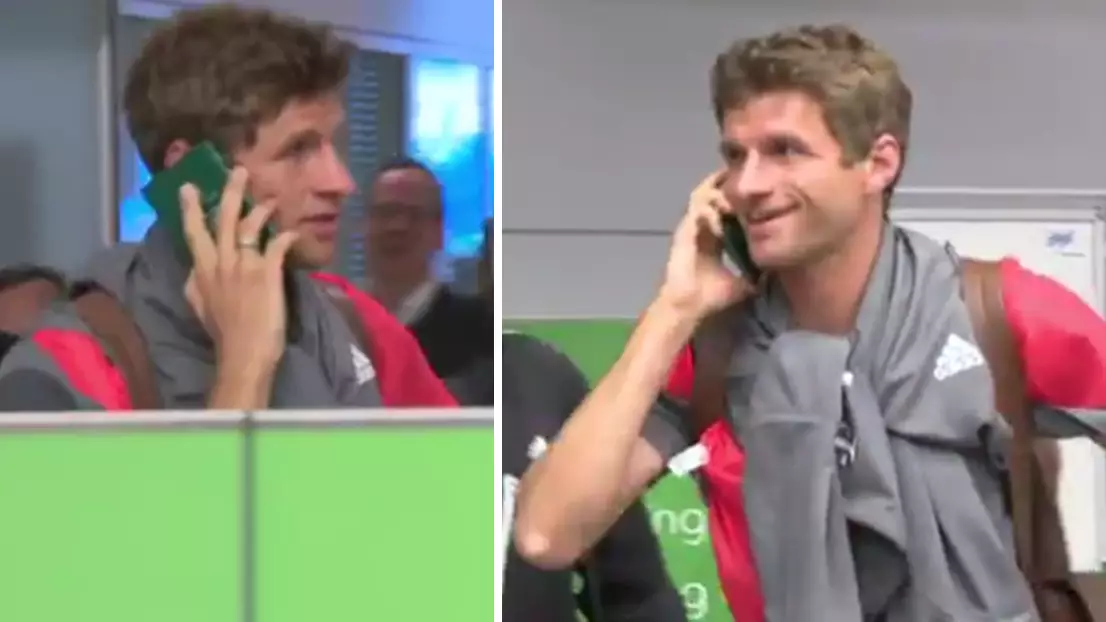 WATCH: The Moment Thomas Muller Dodged The Press By Having A Phone Call On His Passport