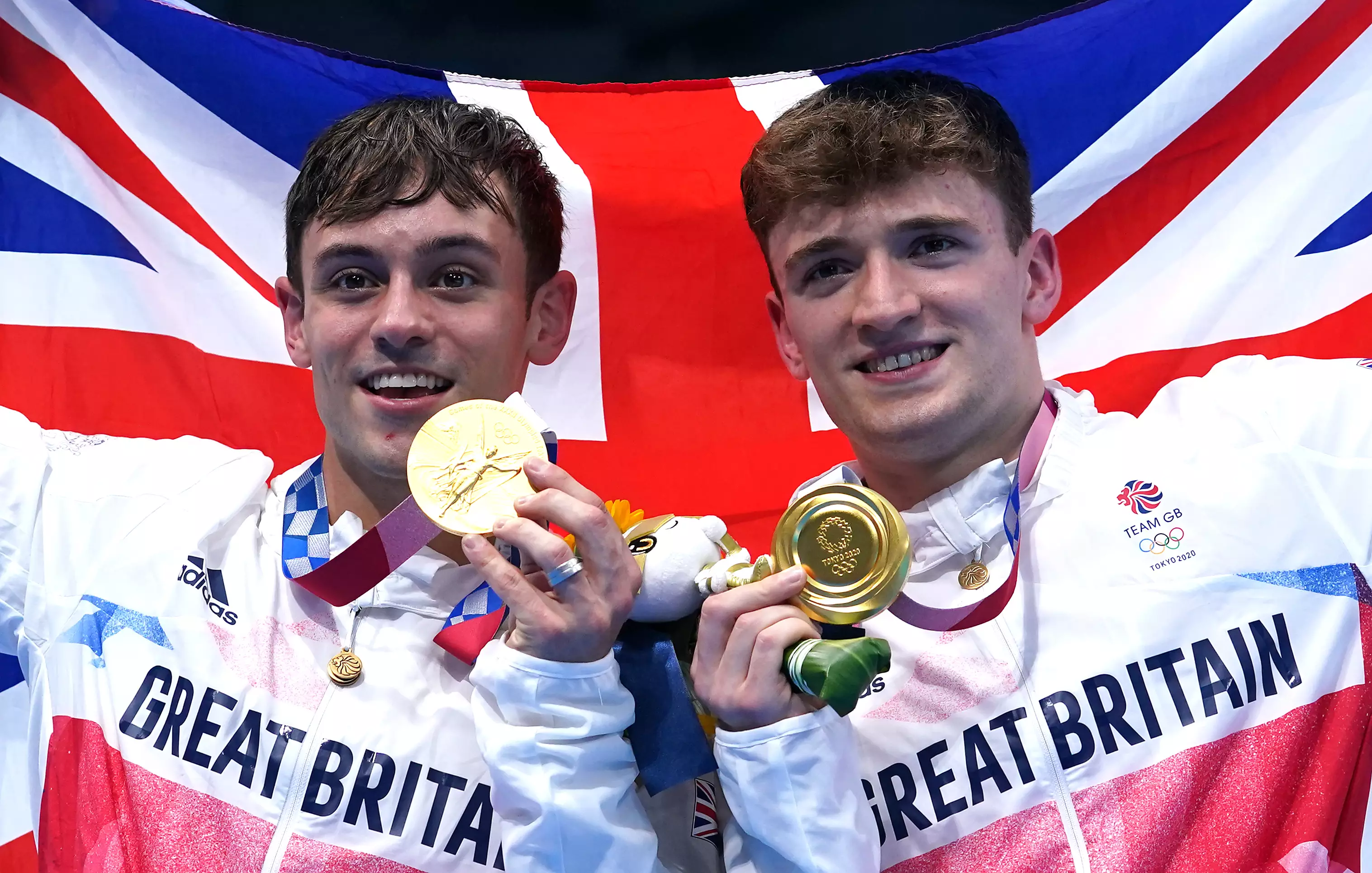 Tom Daley and Matty Lee winning gold medals for the men's 10m synchronised dive. (