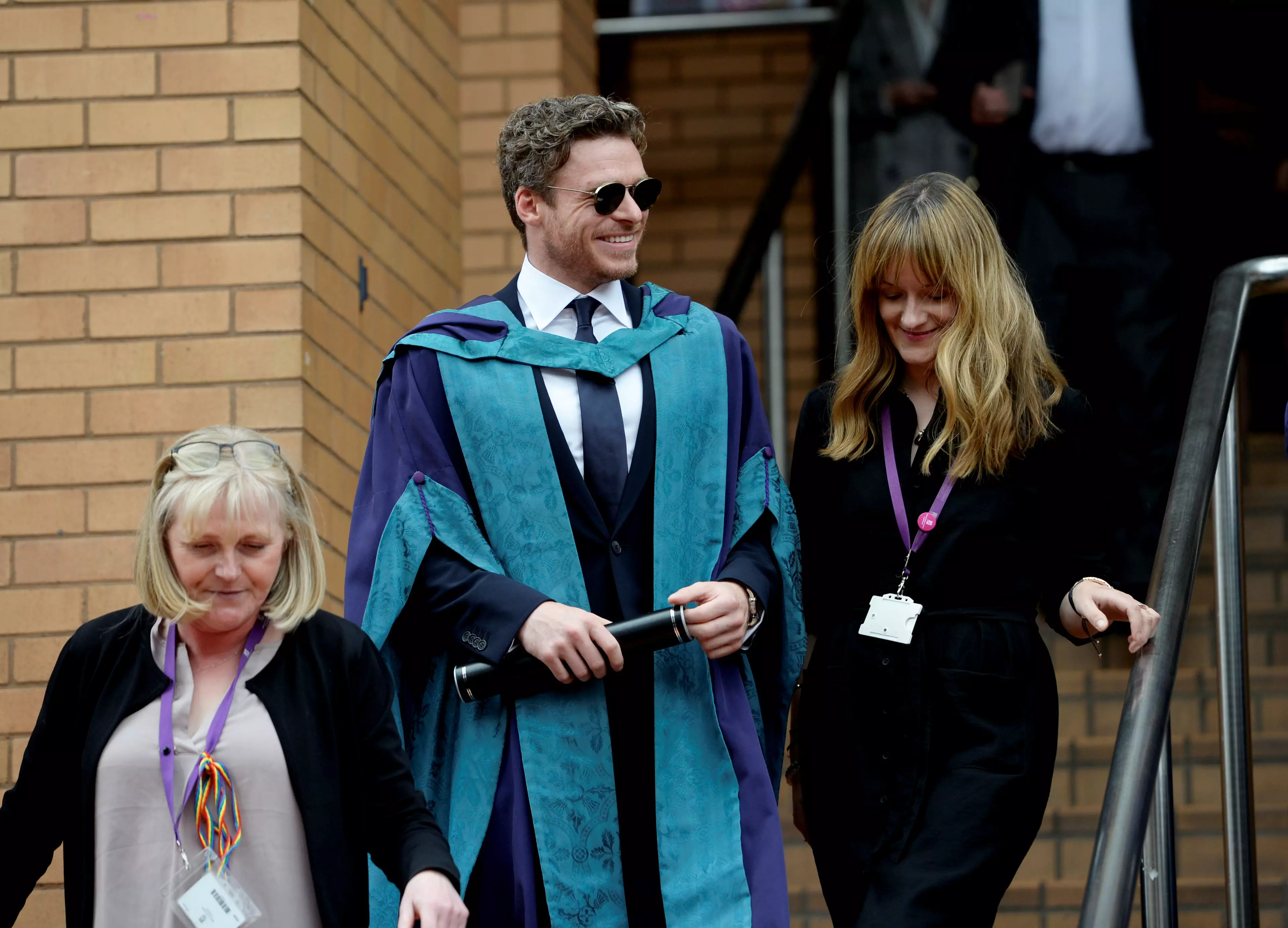The Bodyguard star attended in a graduation gown.