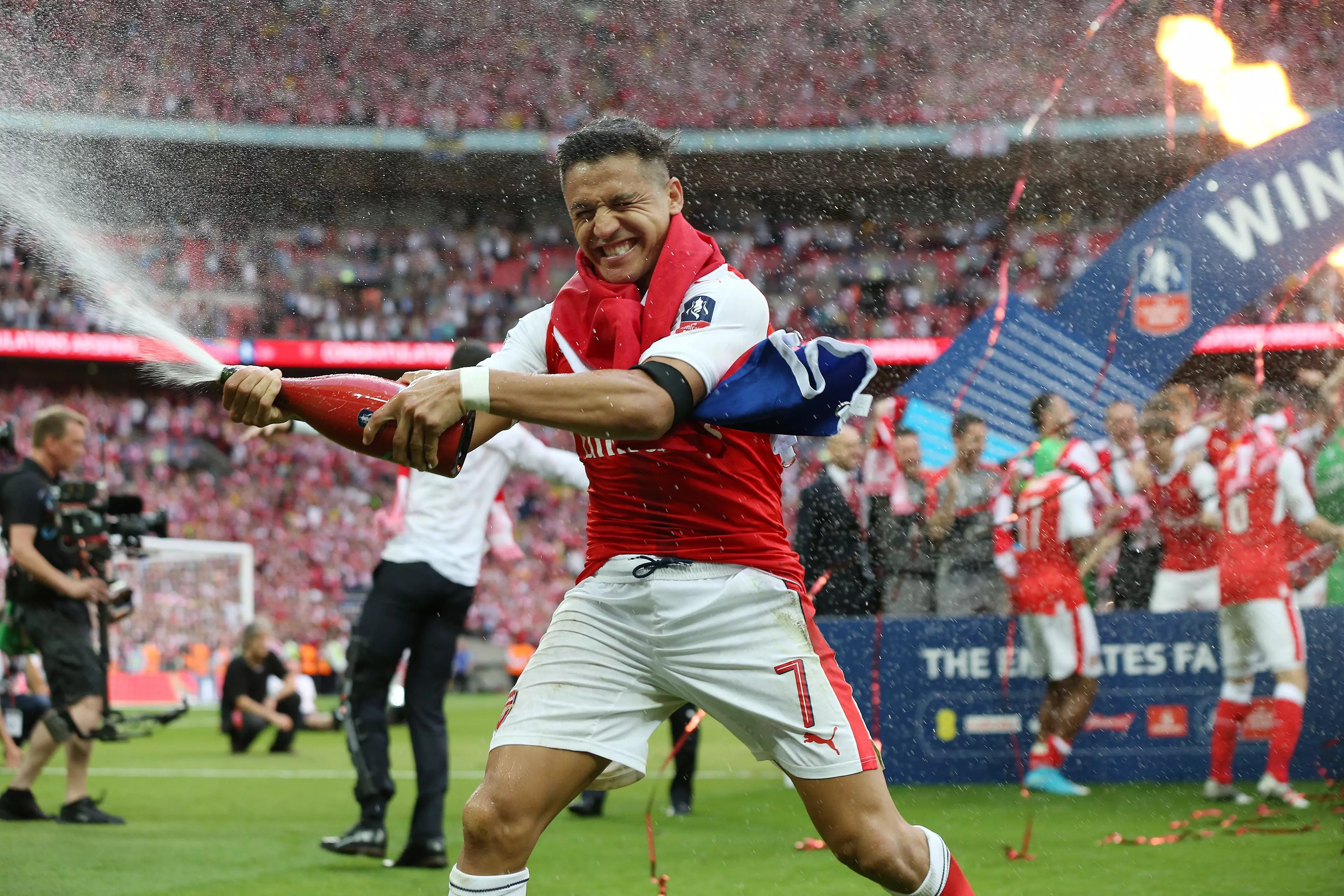 Things haven't been good for Sanchez at United. In happier times (bottom) winning the FA Cup with Arsenal. Images: PA Images