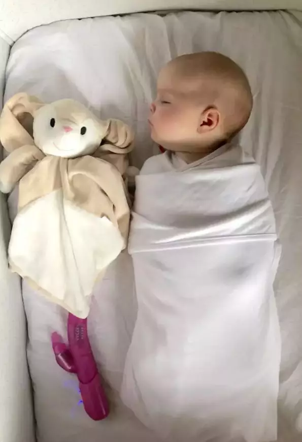 Baby Lucie with her unconventional sleeping aid.