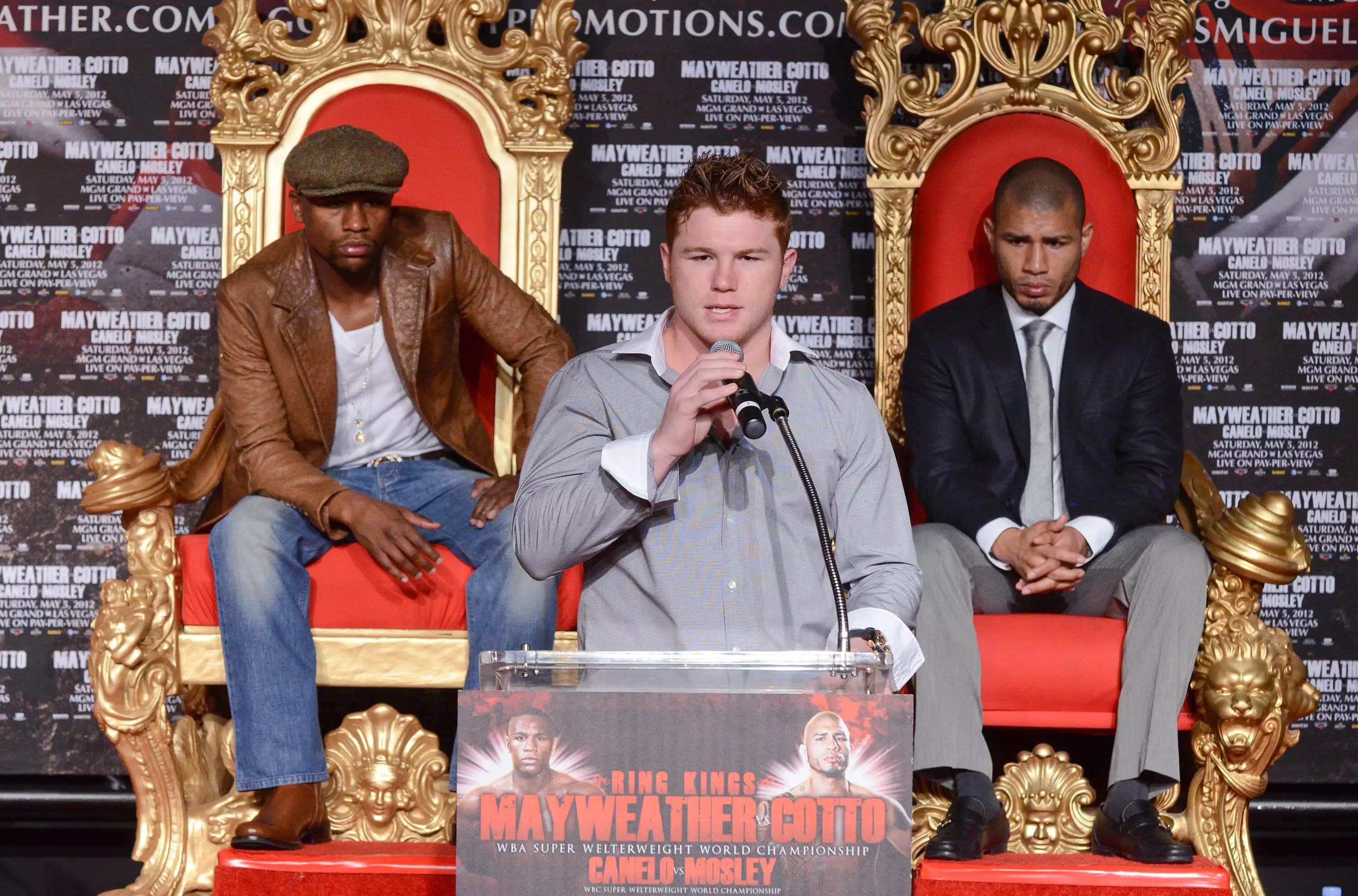 Mayweather, left, watches Canelo at a press conference in 2012 when they were on the same bill. Image: PA Images