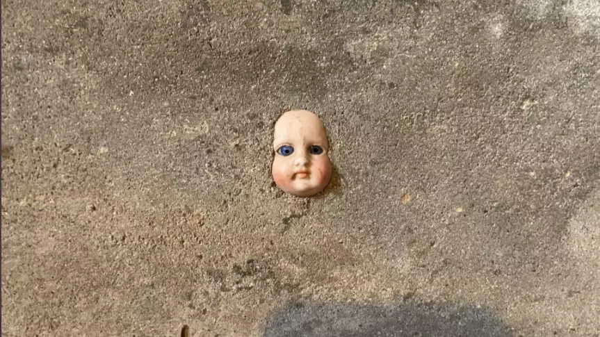 Woman Told To Move House After Finding Doll's Face In Cellar Wall