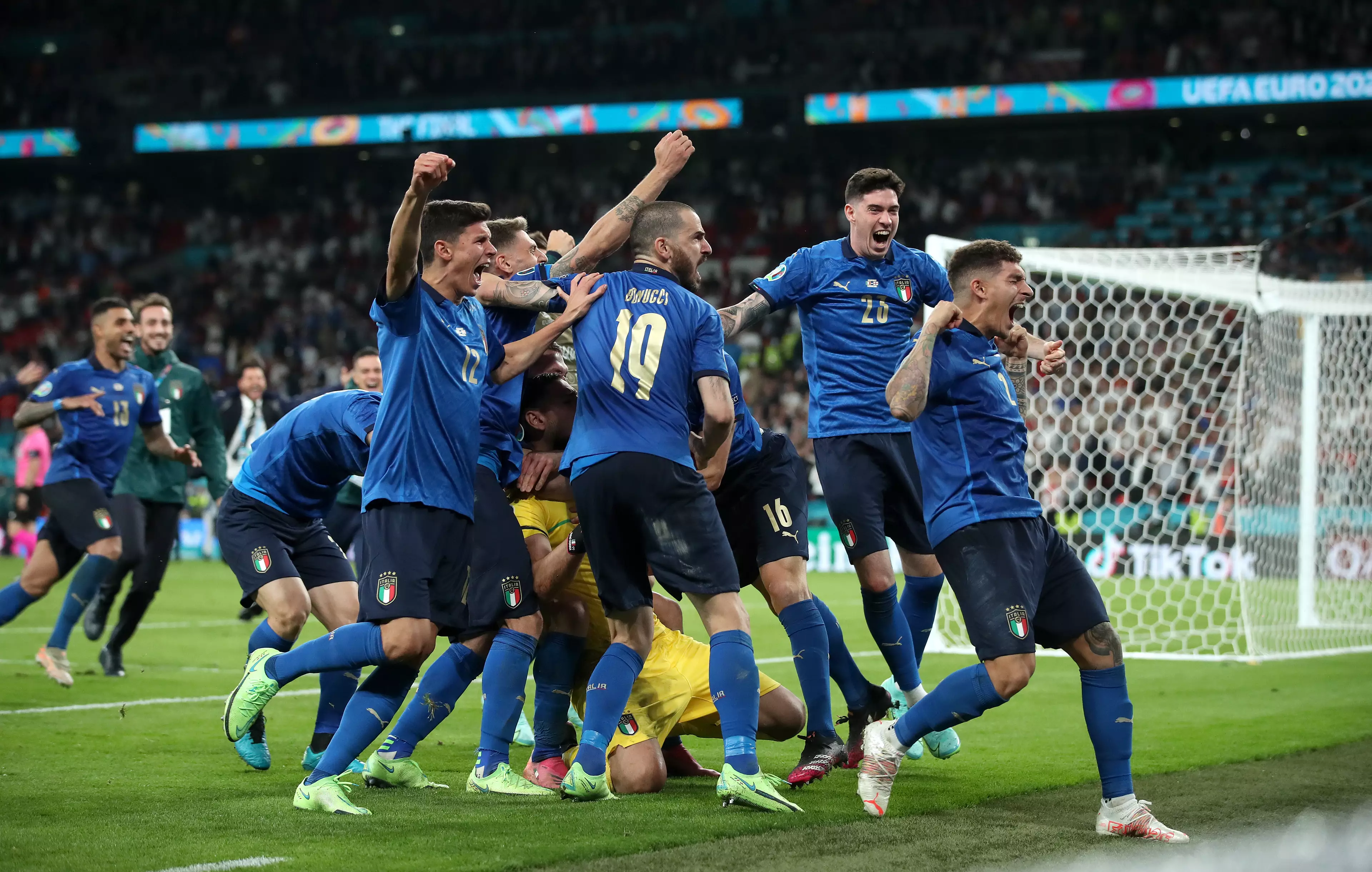 Italy celebrate their victory.