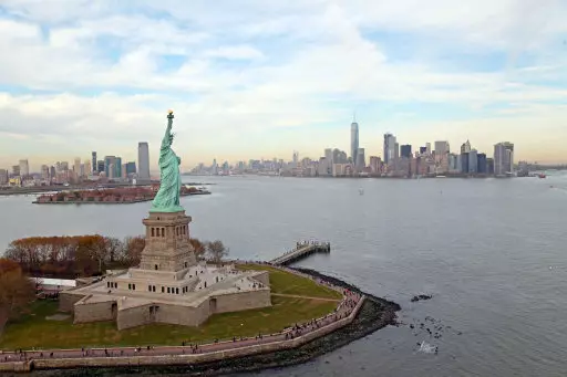An aerial view of the Statue of Liberty and the New York City Skyline in Manhattan.