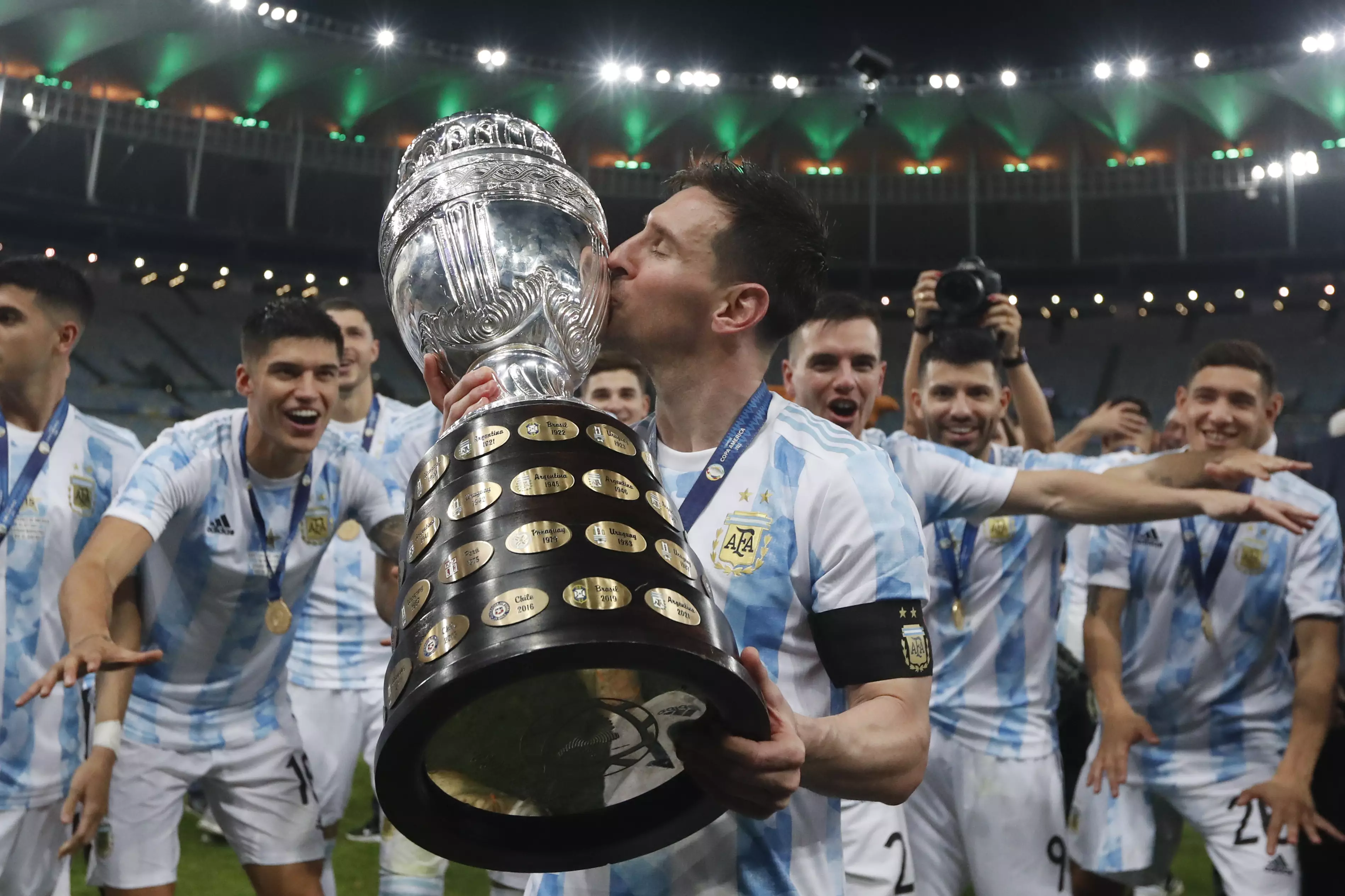 Messi gives the Copa America trophy a kiss. Image: PA Images
