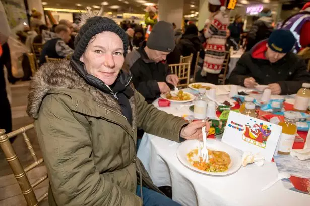 Louise Gall enjoying the Christmas meal at Birmingham New Street station.