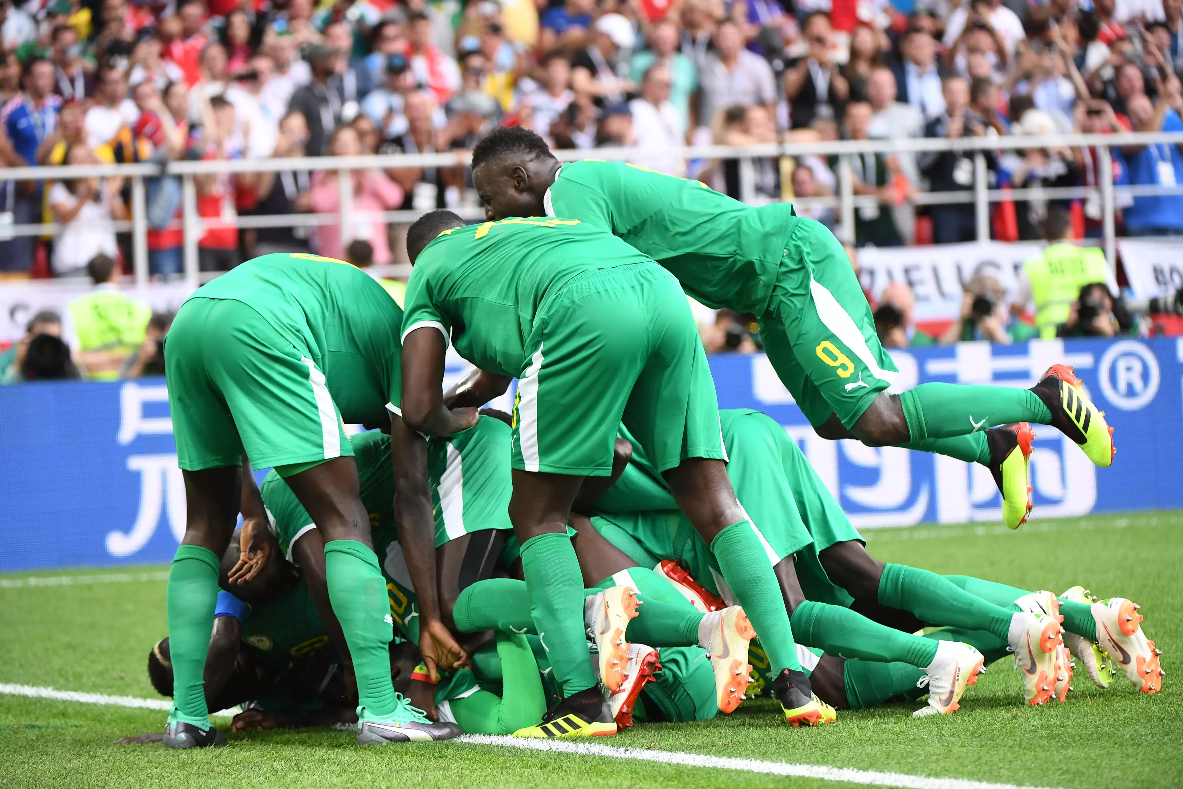 Senegal players celebrating scoring. Image: PA