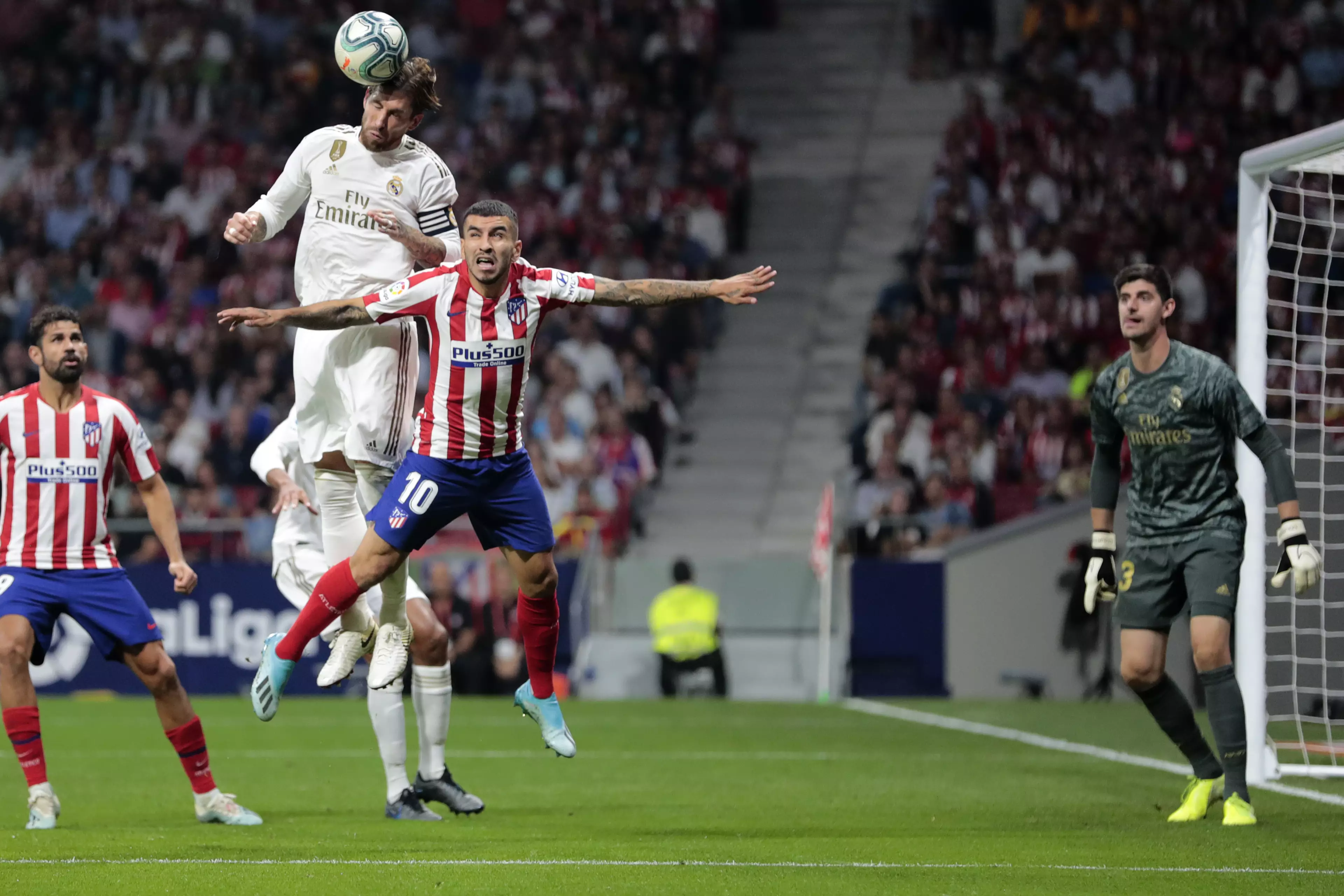 Ramos leaps for the ball in the Madrid derby. Image: PA Images