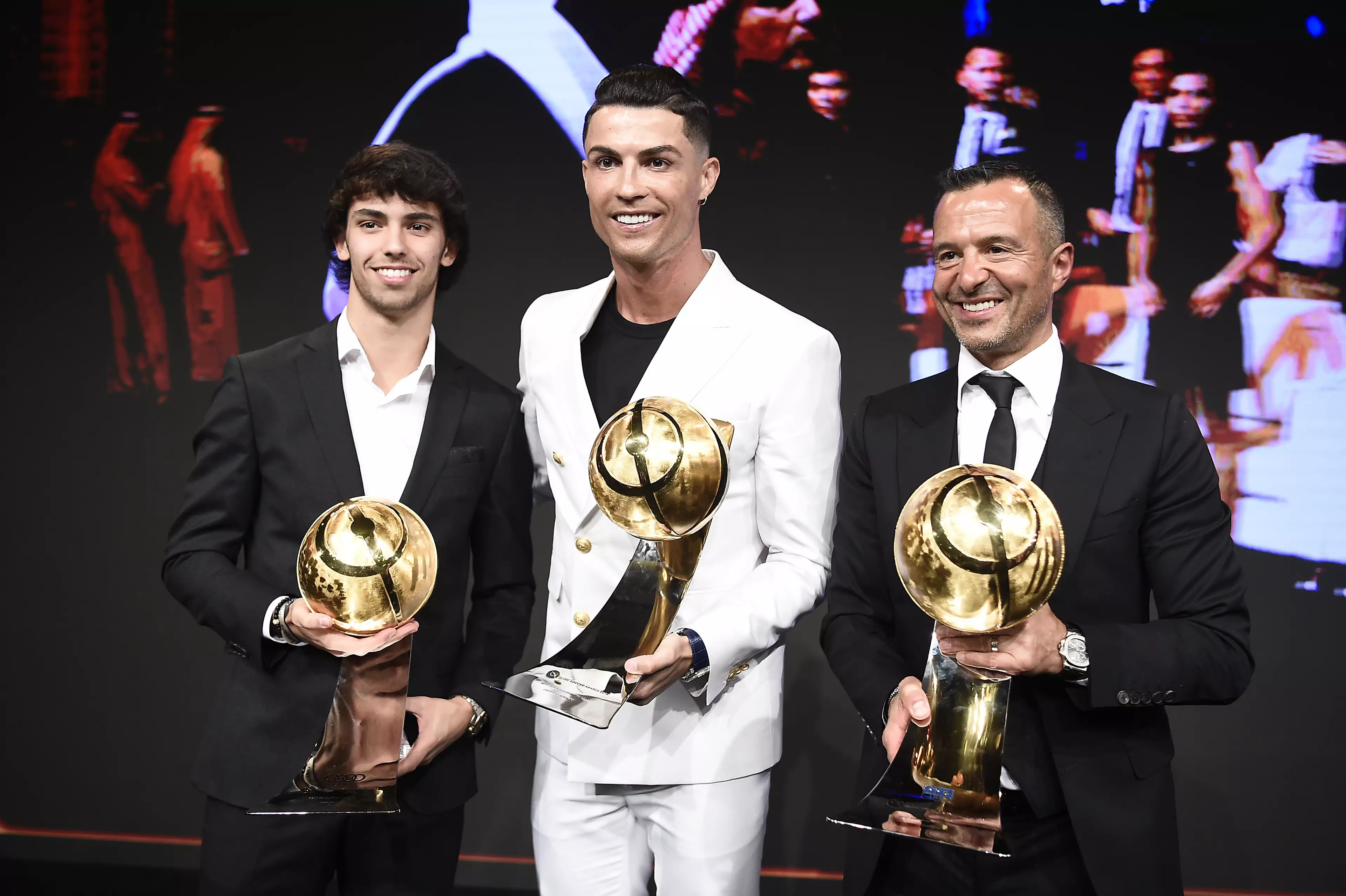 Jorge Mendes with future Wolves signings Cristiano Ronaldo and Joao Felix. Image: PA Images