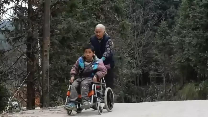 Elderly Woman Walks 15 Miles A Day To Get Disabled Grandson To School 