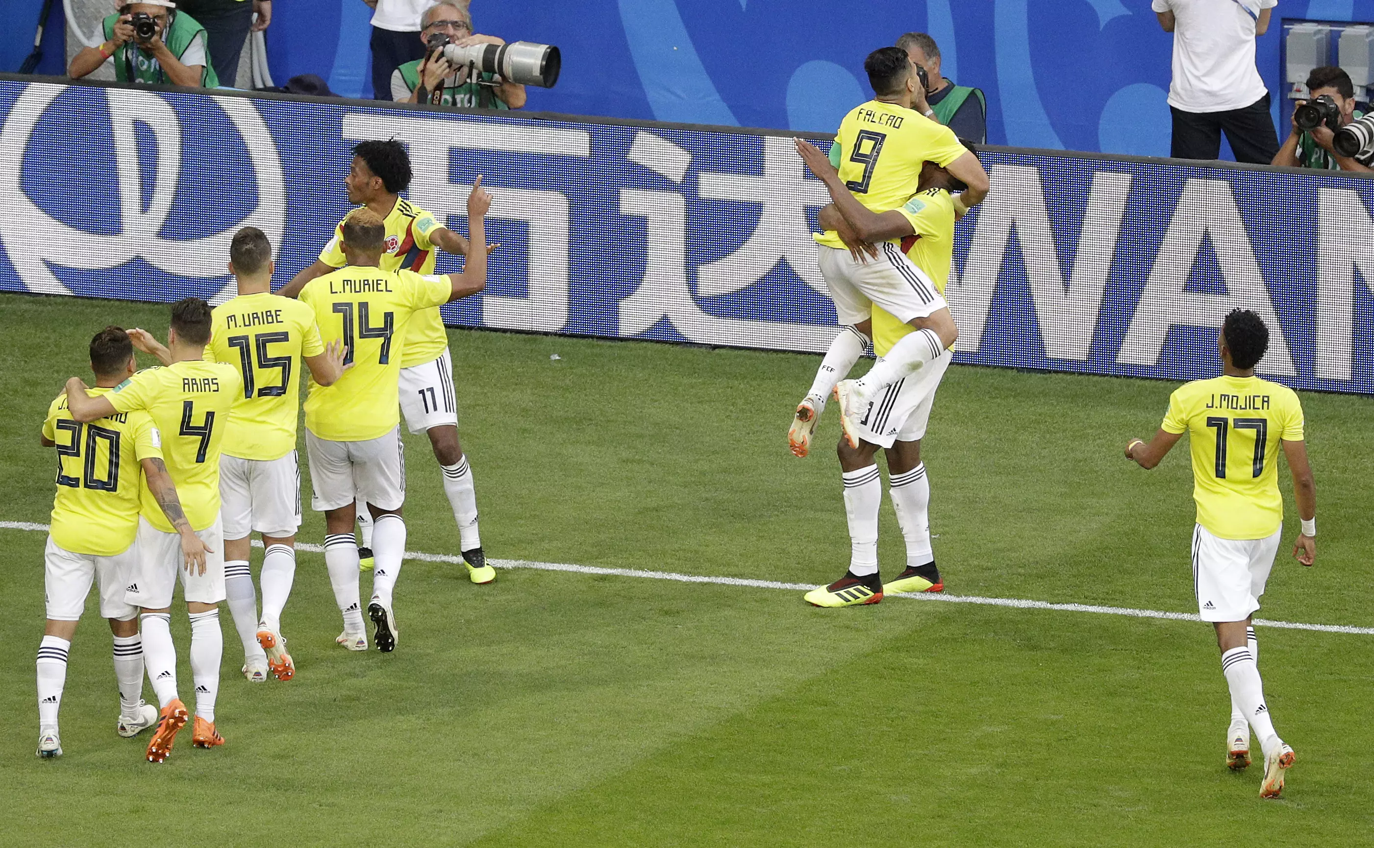 Colombia celebrate Yerry Mina's winner that took them top. Image: PA Images