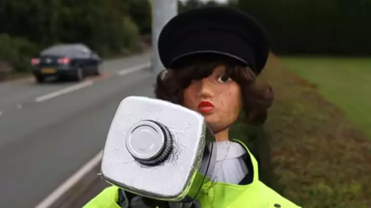 An Undercover Scarecrow Is Being Used To Slow Down Speeding Motorists
