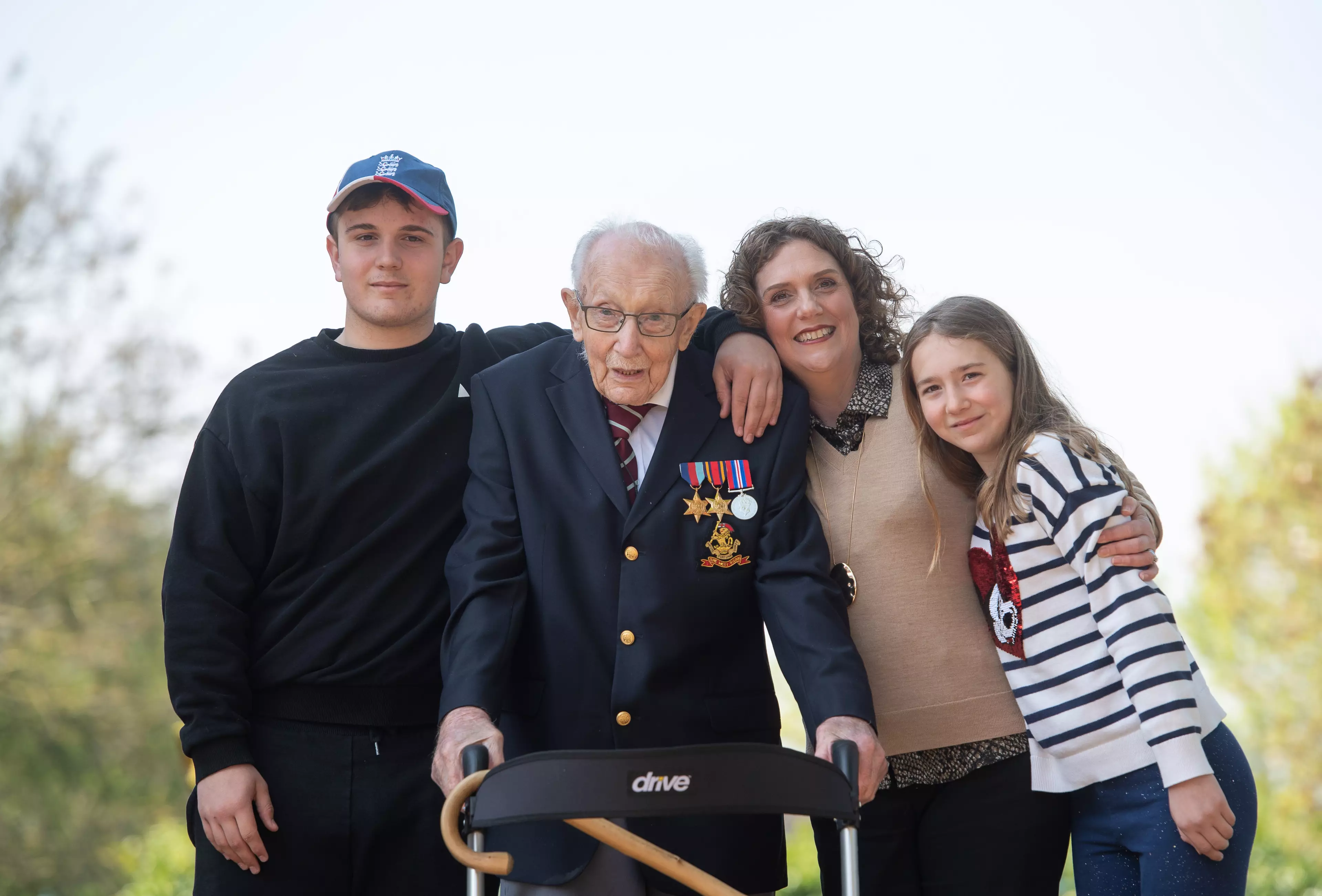 Captain Tom pictured with his family in Bedfordshire (