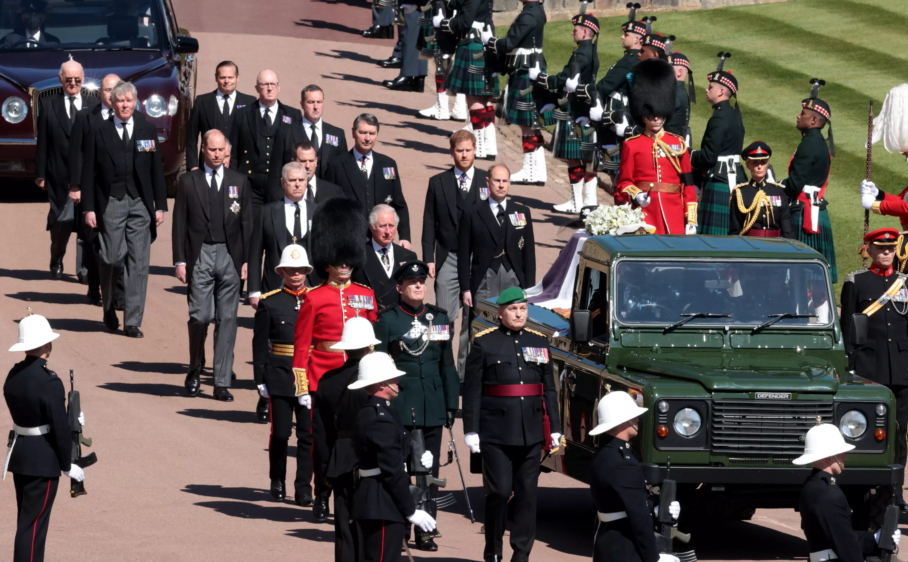 His coffin was carried to the chapel on a Land Rover he helped design.