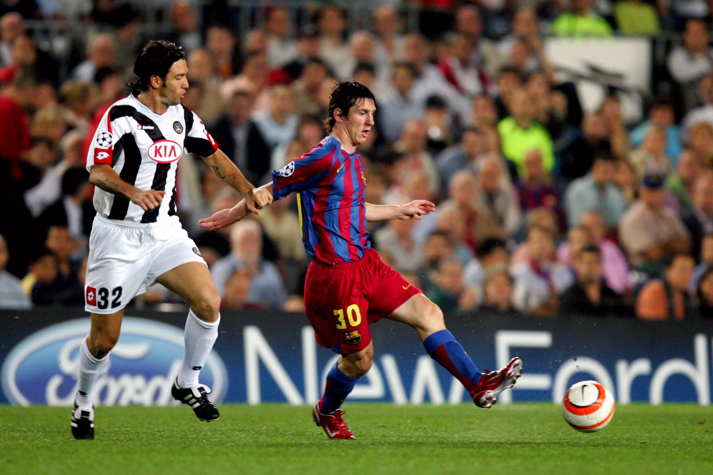 Barcelona's Lionel Messi and Udinese's Vincent Candela battle for the ball in 2005. Image: PA