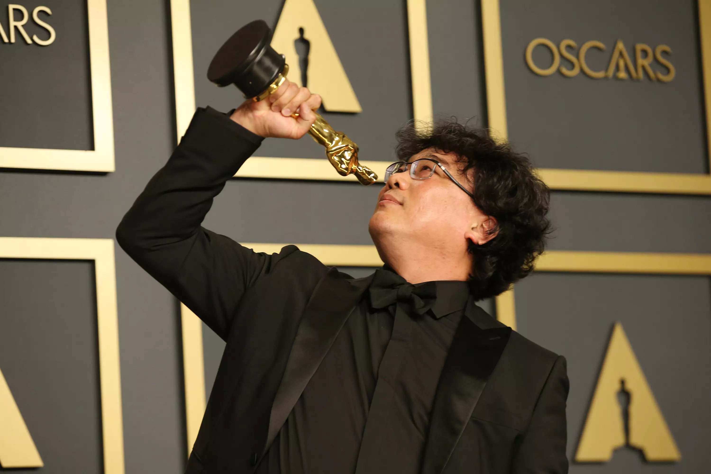 Bong Joon-ho with one of his many Oscars.