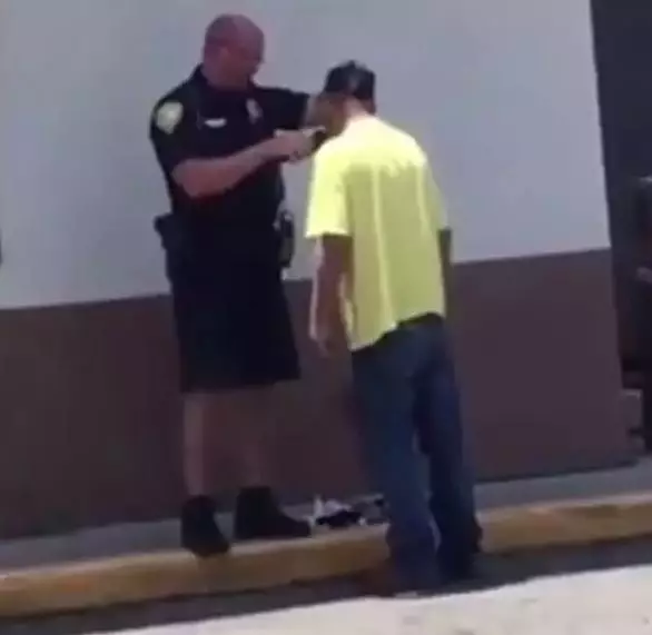 Officer Tony Carlson was praised for helping a homeless man.