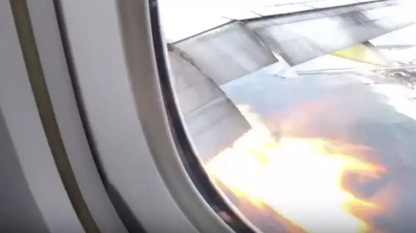 Terrified Passengers Look On In Horror As Flames Burst From Plane's Wing
