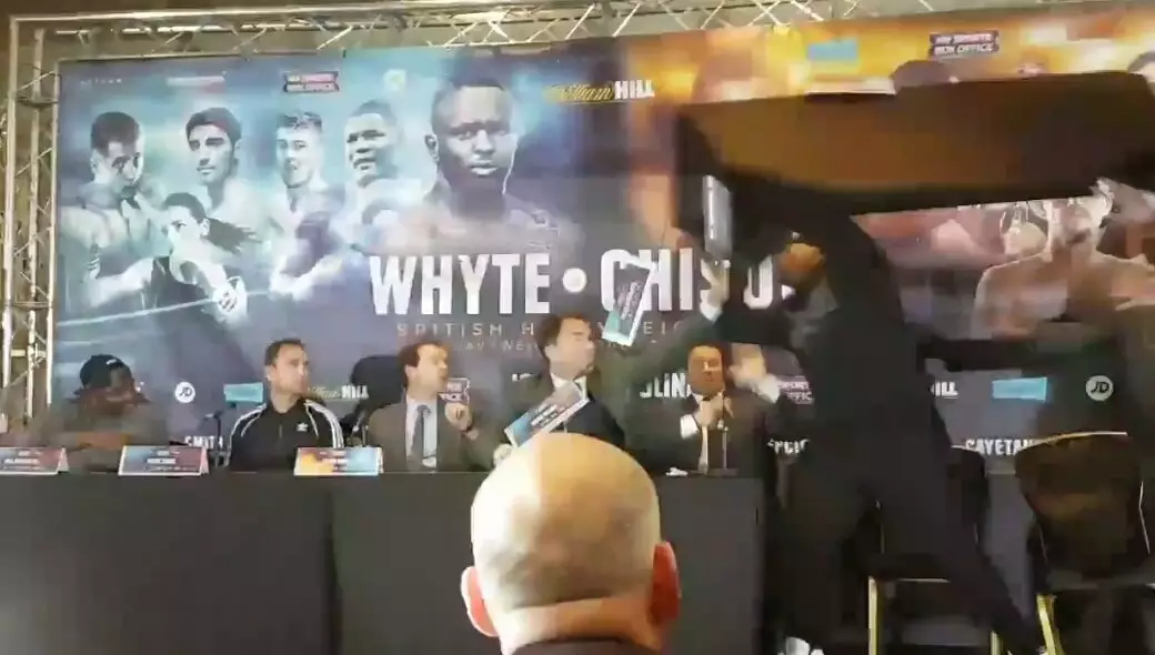 WATCH: Dereck Chisora Throws A Table At Dillian Whyte 