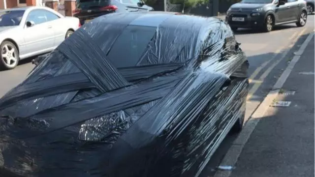 Man Wraps His Neighbour’s Entire Car In Cellophane After It Blocked His Driveway