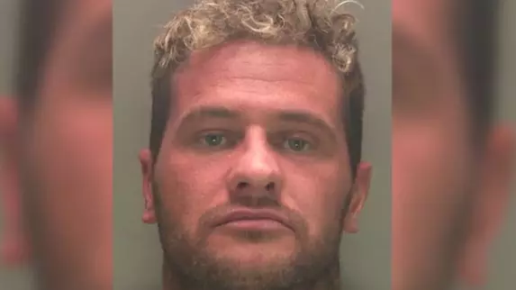 Fugitive Unhappy With Police Mugshot Shares More Flattering Selfie