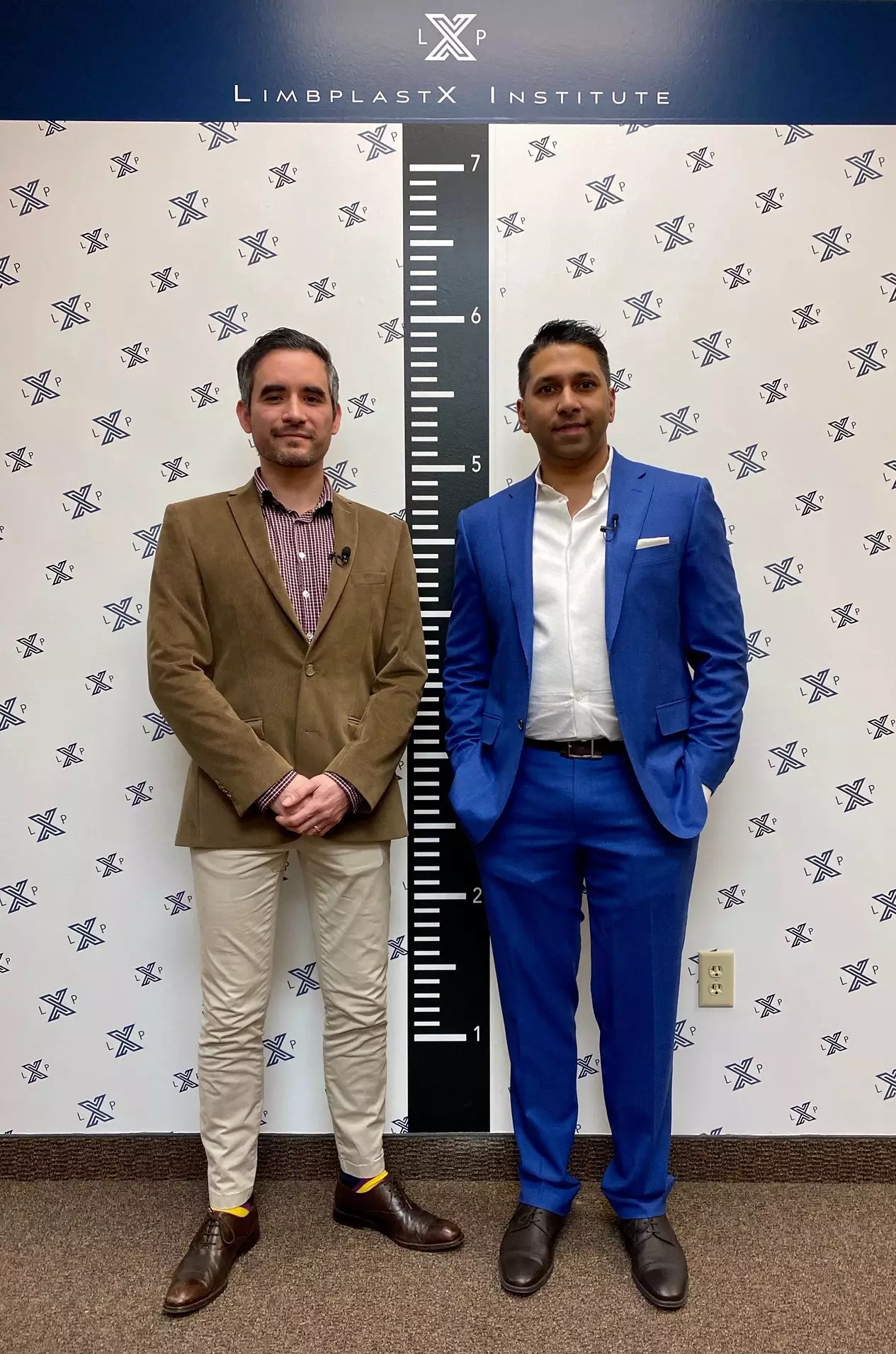 Patient Irving Rodríguez (left) after the stretching surgery, standing almost three inches taller alongside Dr Debiparshad (right).