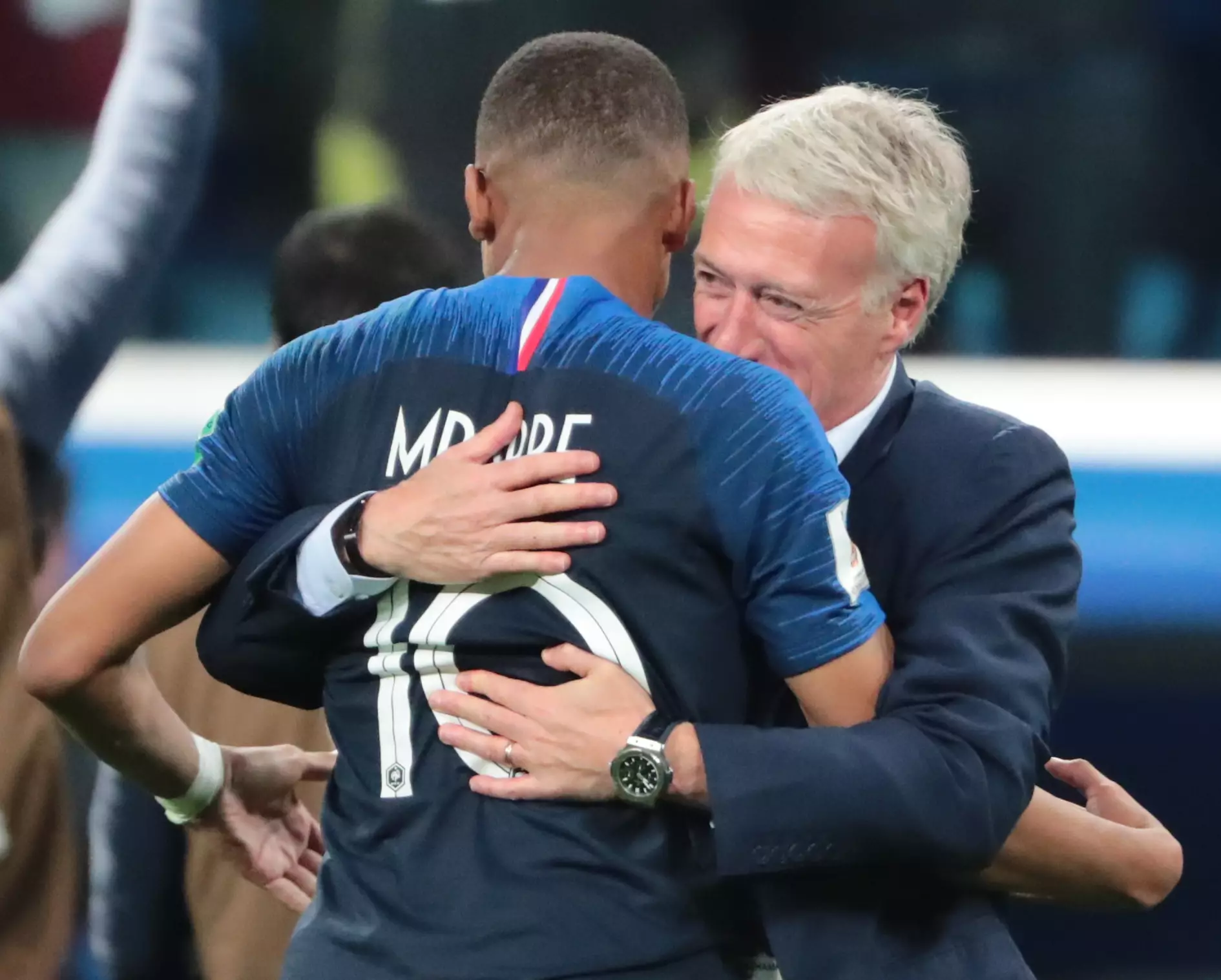 Mbappe hugs Didier Deschamps. Image: PA