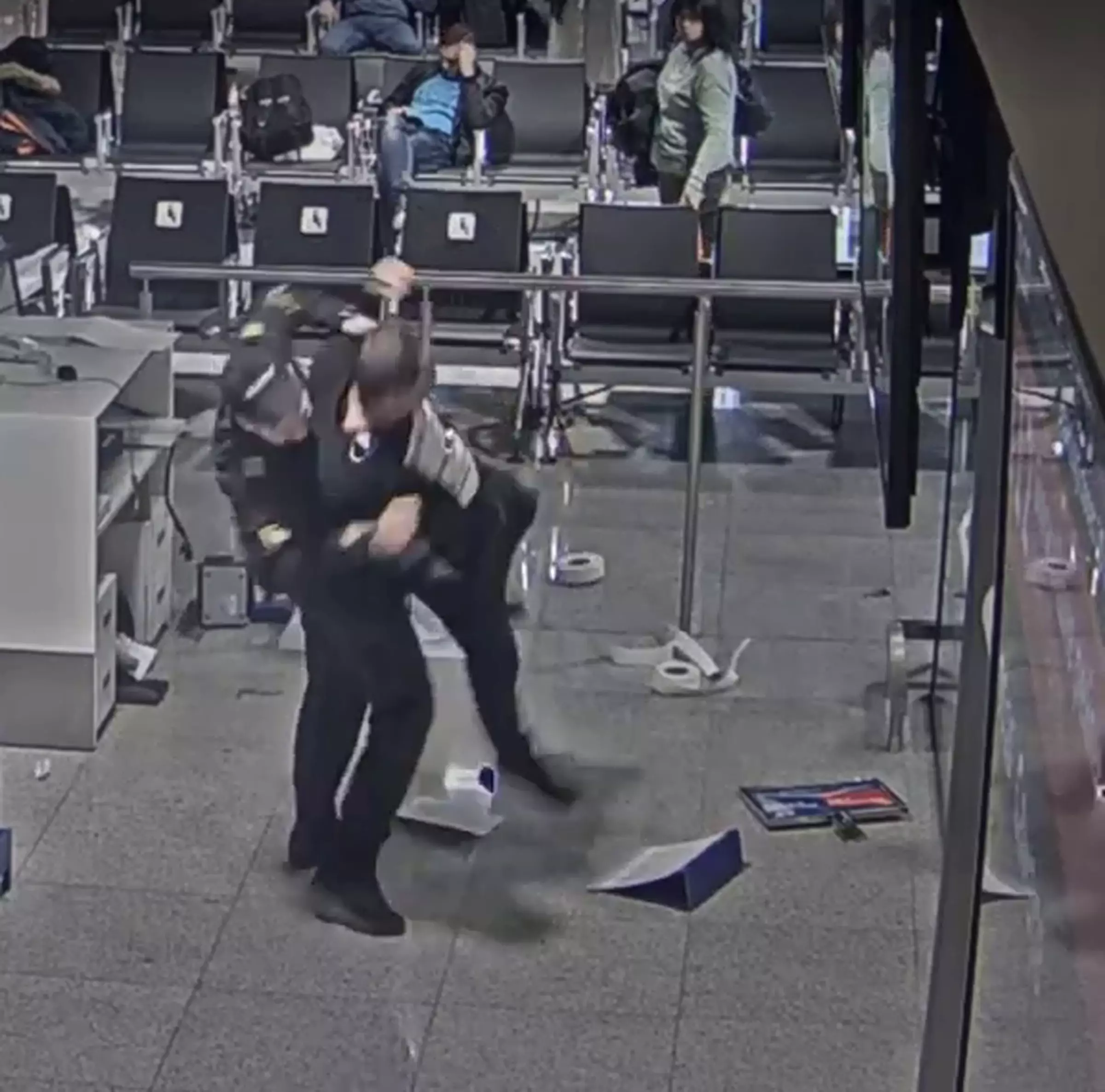 Airport security turned up and tackled the bloke to the floor.