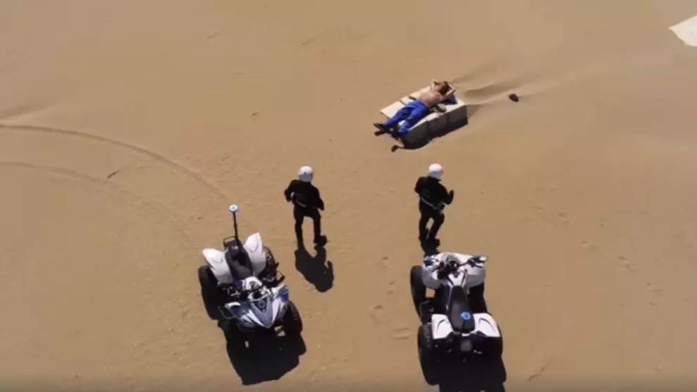 Italian Police Swarm Around Man Sunbathing On Deserted Beach
