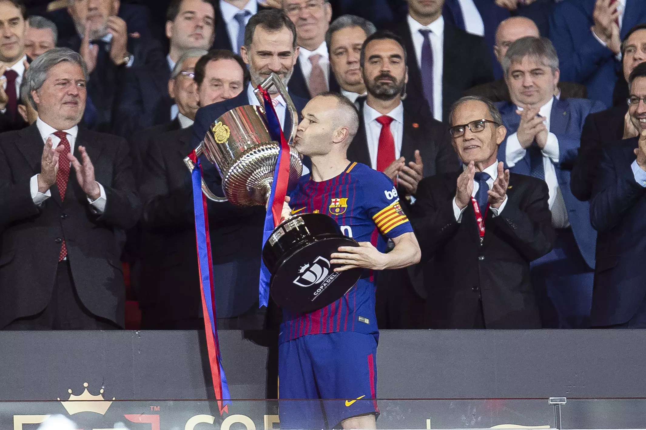 Iniesta plants a kiss on the Copa del Rey. Image: PA
