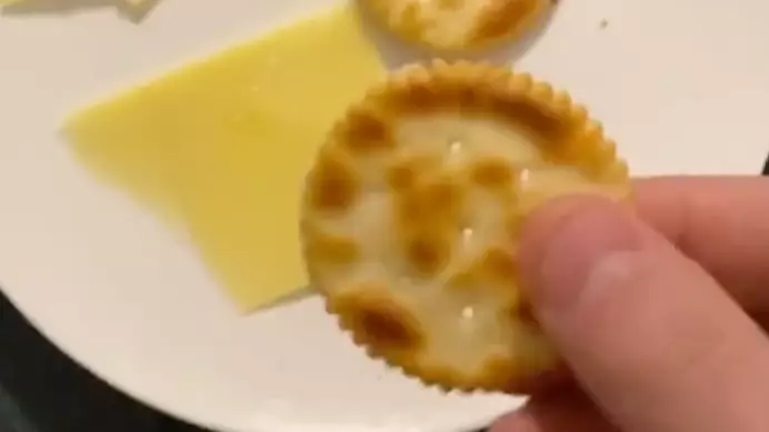 Man Discovers You Can Cut Cheese Using Jagged Edges Of Arnott's Crackers