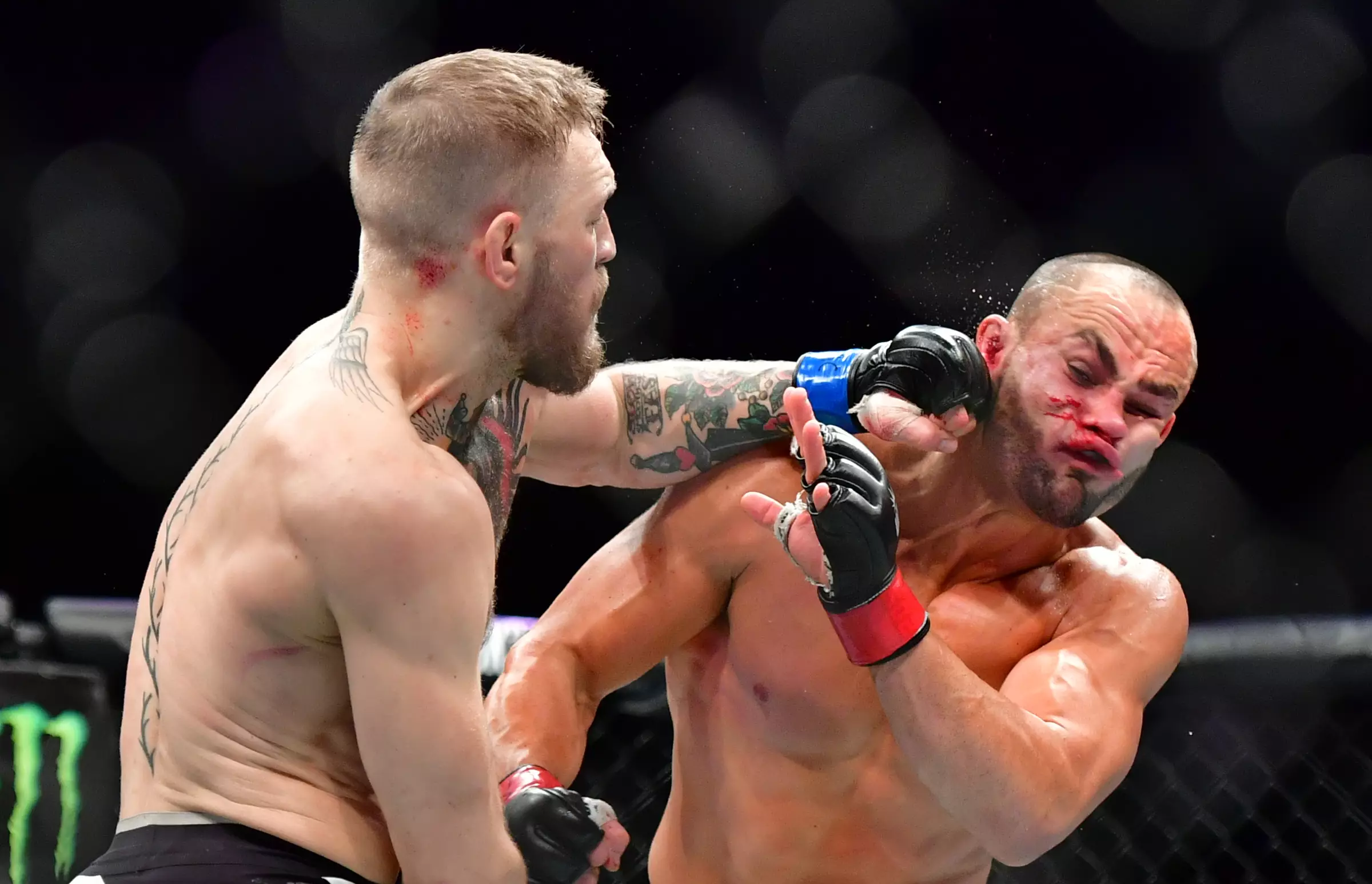 McGregor lands a clubbing left-hand flush on Alvarez's chin. Image: PA