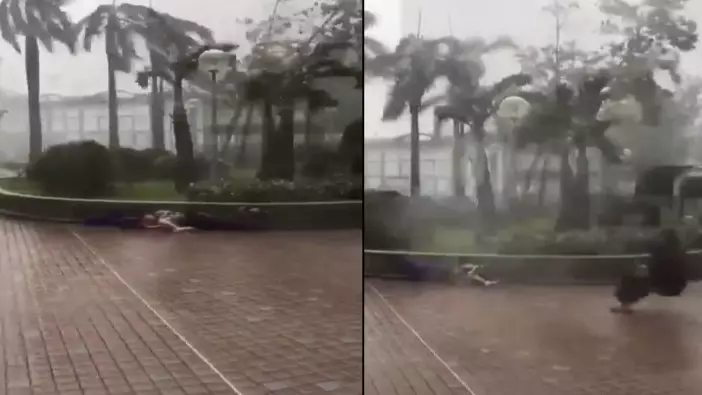 Pedestrians Swept Off Their Feet And Slammed Into Wall As They Battle 110 Mph Typhoon Mangkhut