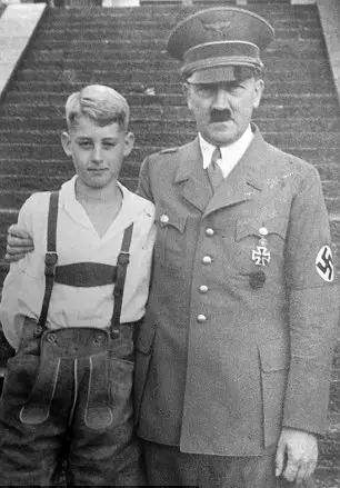 Lutz's son standing with Hitler.