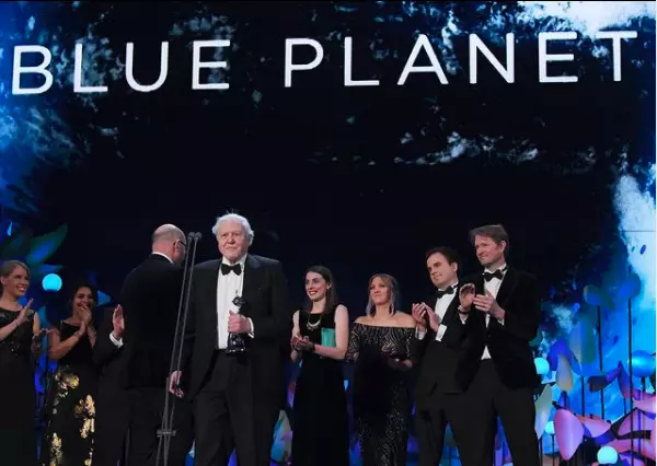 Sir David Attenborough and the team behind Blue Planet II at the NTAs in 2018. (
