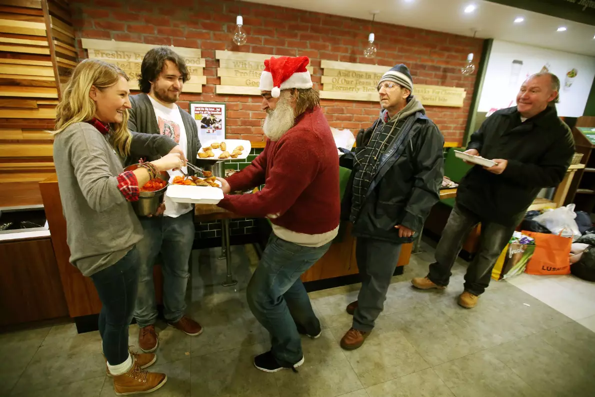 People receiving a free Christmas meal at Social Bite sandwich bar in Edinburgh.